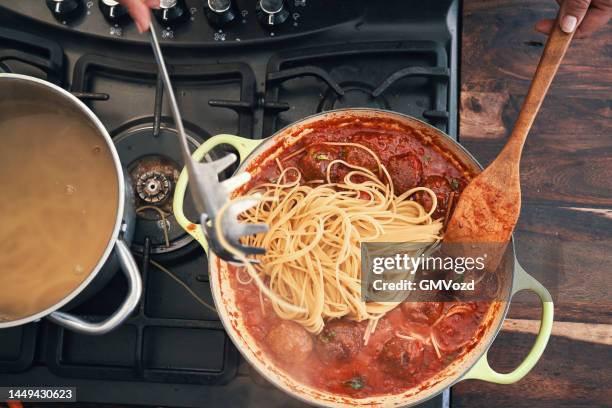 preparing meatball spaghetti with tomato sauce - meatball stock pictures, royalty-free photos & images