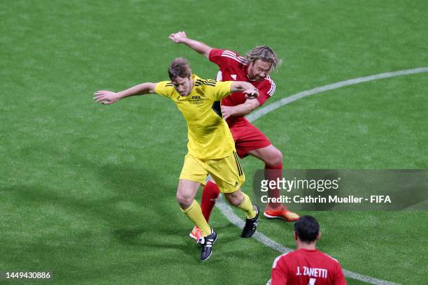 Massimo Ambrosini of European Wolves battles for possession with Diego Lugano of South American Panthers during the FIFA Legends Cup match between...