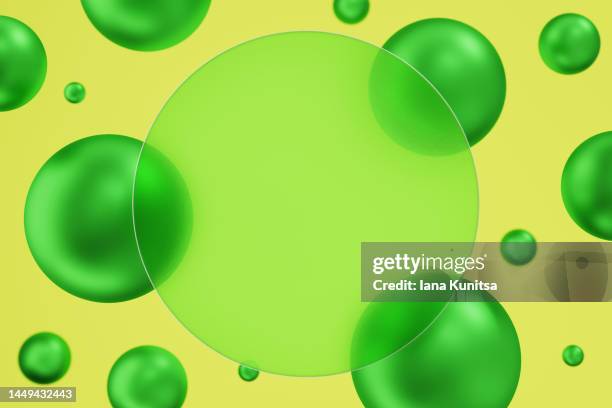 bright green 3d bubbles, spheres and place for text and product on yellow background. - energy abstract green background stock pictures, royalty-free photos & images