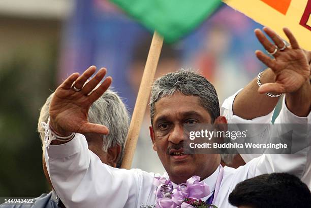 Sri Lankan former army chief Sarath Fonseka waves to his supporters after he was released from jail on May 21, 2012 in Colombo, Sri Lanka. Sri...