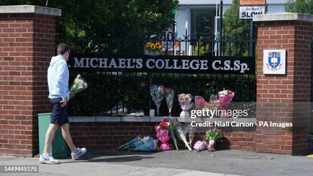 Flowers outside St, Michael's College in Dublin, Ireland, after the deaths of two recent graduates on the Greek island of Ios. Tributes have been...