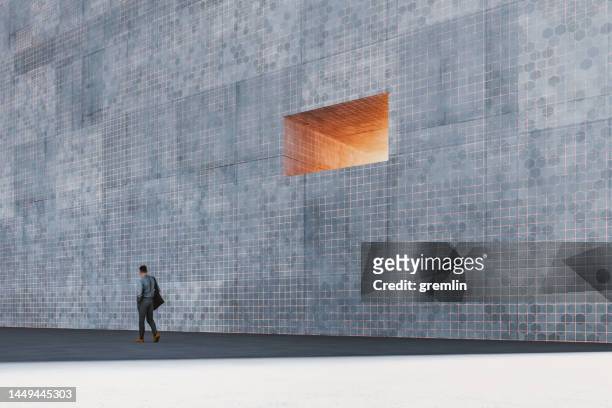 lonely businessman walking in futuristic city - escaping maze stock pictures, royalty-free photos & images