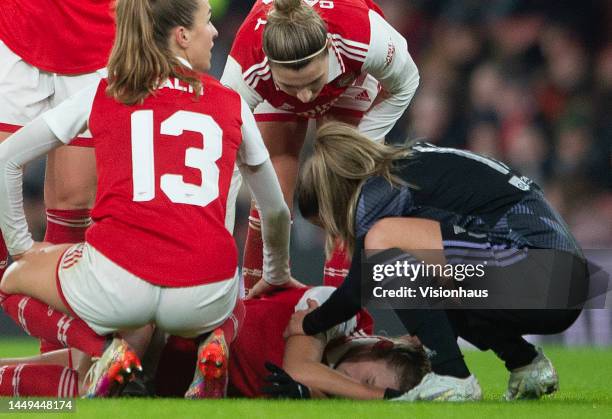 Vivianne Miedema of Arsenal Women receives treatment on the pitch after injury during the UEFA Women's Champions League group C match between Arsenal...