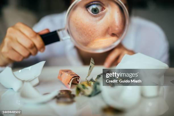 woman looking at her savings from broken piggy bank. - counting stock pictures, royalty-free photos & images