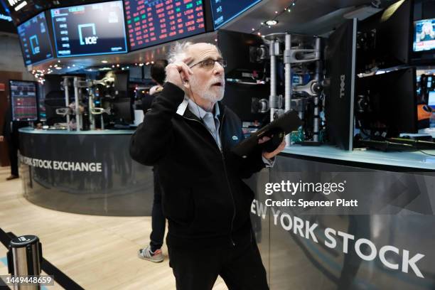 Stock trader Peter Tuchman works on the floor of the New York Stock Exchange on December 15, 2022 in New York City. Stocks fell over 700 points as...