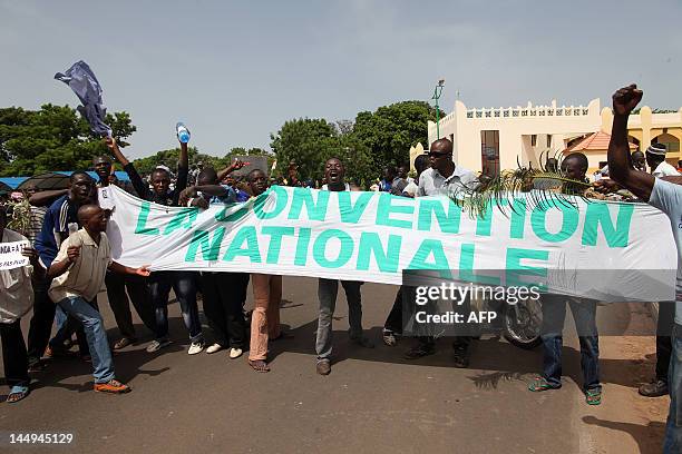 Some of thousands of Malians, holding a banner reading "The National Convention" protest on May 21, 2012 in Bamako against a transition deal giving...