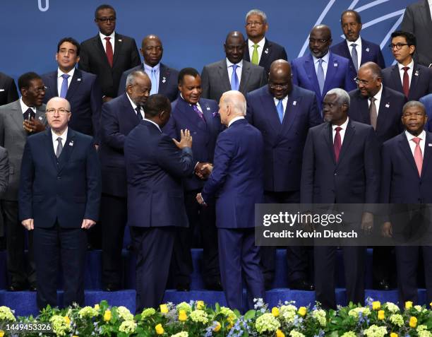 President Joe Biden shakes hands with the President of the Republic of Congo Denis Sassou Nguesso during the group photo at the U.S. - Africa Leaders...