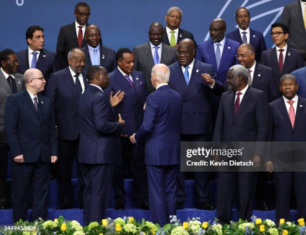 President Joe Biden talks to fellow leaders during the group photo at the U.S. - Africa Leaders Summit on December 15, 2022 in Washington, DC. The...