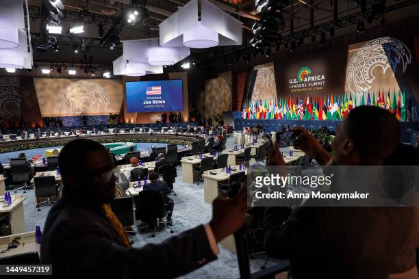 Journalists take images with their cell phones as U.S President Joe Biden gives remarks at a closing session on Food Security at the U.S. - Africa...
