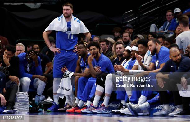 Luka Doncic of the Dallas Mavericks watches action from the bench after being called for a foul against the Cleveland Cavaliers in the second half at...