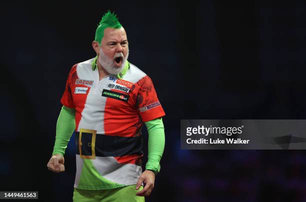 Peter Wright of Scotland reacts during the First Round match against Mickey Mansell of Northern Ireland at Alexandra Palace on December 15, 2022 in...