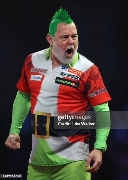 Peter Wright of Scotland reacts during the First Round match against Mickey Mansell of Northern Ireland at Alexandra Palace on December 15, 2022 in...