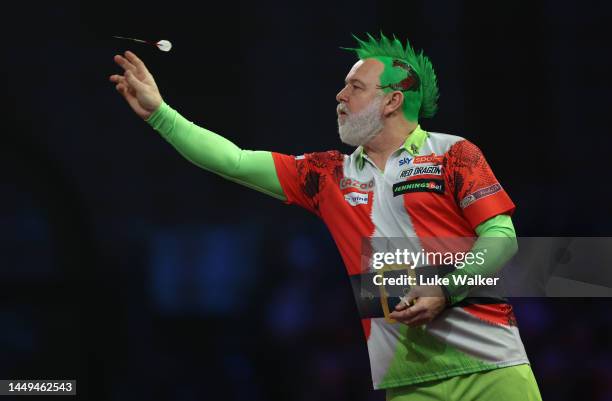 Peter Wright of Scotland in action during the First Round match against Mickey Mansell of Northern Ireland at Alexandra Palace on December 15, 2022...