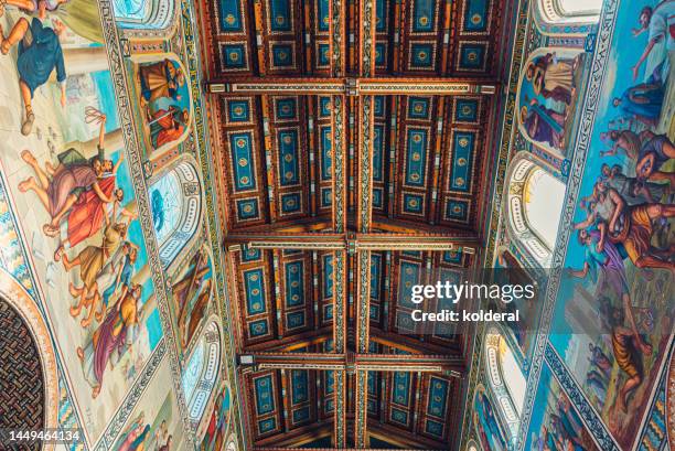 beautiful interior of beit jamal monastery st stephene catholic church , murals with biblical episodes - christian spirituality stock pictures, royalty-free photos & images