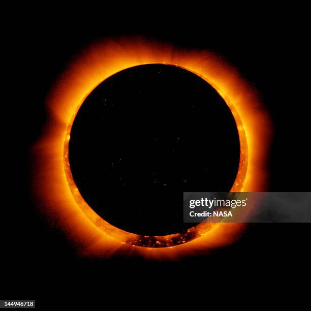 In this handout provided by NASA, sun spots are seen as the moon moves into a full eclipse position after reaching annularity during the first...