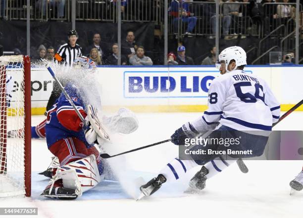 Michael Bunting of the Toronto Maple Leafs sprays ice on Igor Shesterkin of the New York Rangers during the first period at Madison Square Garden on...