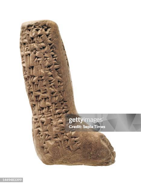 Cuneiform tablet in the shape of a leg, clay, Total: Height: 7.00 cm; Width: 4.20 cm; Depth: 2.40 cm, Inscription: covering the entire object,...