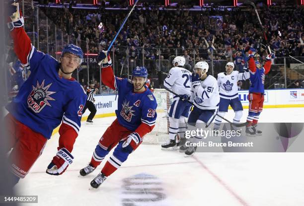 Jimmy Vesey of the New York Rangers scores a second period goal against Matt Murray of the Toronto Maple Leafs and is joined by Chris Kreider at...