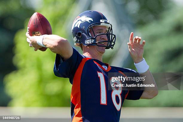 Peyton Manning of the Denver Broncos throws during organized team activities at Dove Valley on May 21, 2012 in Englewood, Colorado.