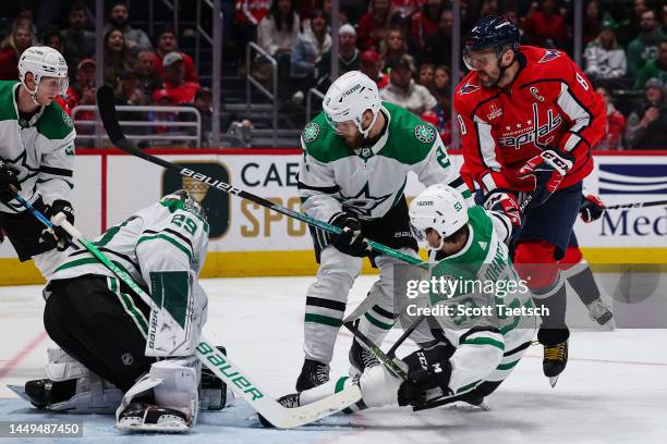 Jake Oettinger of the Dallas Stars makes a save in front of Alex Ovechkin of the Washington Capitals during the second period of the game at Capital...