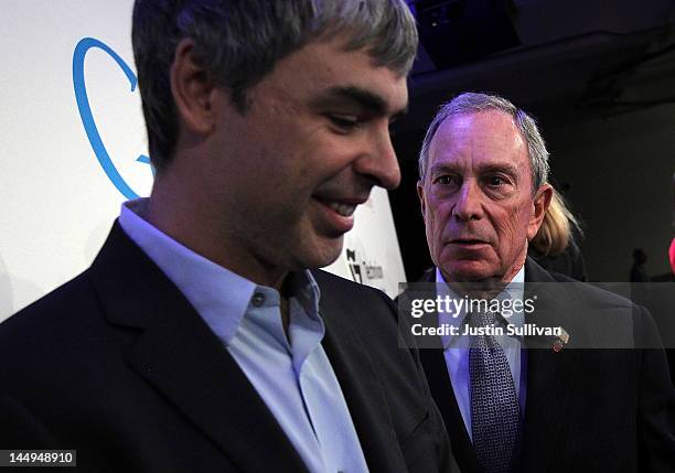 New York City Mayor Michael Bloomberg talks with Google co-founder and CEO Larry Page after a news conference at the Google offices on May 21, 2012...