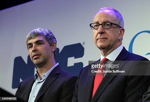Google co-founder and CEO Larry Page looks on with Cornell president David Skorton during a news conference at the Google offices on May 21, 2012 in...