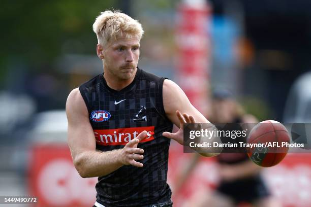 Billy Frampton of the Magpies marks the ball during a Collingwood Magpies AFL training session at AIA Centre on December 16, 2022 in Melbourne,...