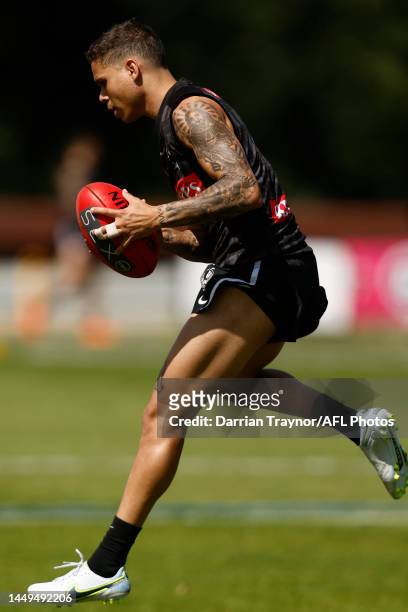 Bobby Hill of the Magpies marks the ball during a Collingwood Magpies AFL training session at AIA Centre on December 16, 2022 in Melbourne, Australia.