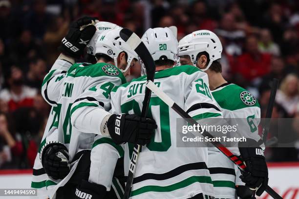 Colin Miller of the Dallas Stars celebrates with teammates after scoring the game winning goal against the Washington Capitals during the third...