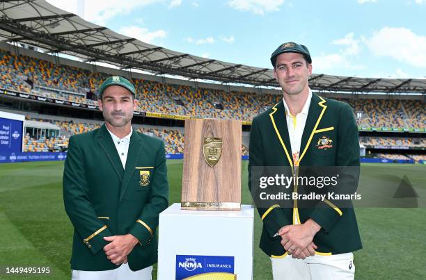 Test Captains Pat Cummins of Australia and Dean Elgar of South Africa pose for a photo during an Australian Test squad training session at The Gabba...