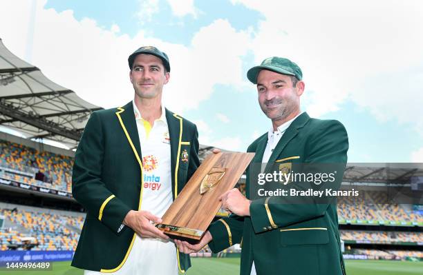 Test Captains Pat Cummins of Australia and Dean Elgar of South Africa pose for a photo during an Australian Test squad training session at The Gabba...