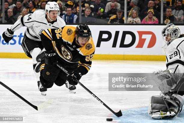 Tomas Nosek of the Boston Bruins dives towards the net against Pheonix Copley of the Los Angeles Kings during the third period at TD Garden on...