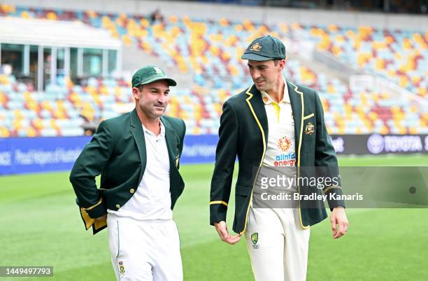 Test Captains Pat Cummins of Australia and Dean Elgar of South Africa chat during a media opportunity at The Gabba on December 16, 2022 in Brisbane,...