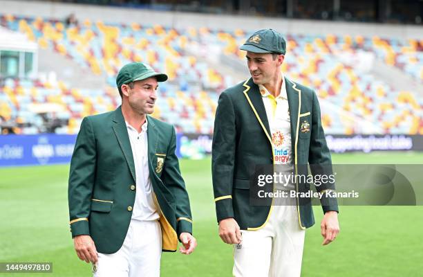 Test Captains Pat Cummins of Australia and Dean Elgar of South Africa chat during a media opportunity at The Gabba on December 16, 2022 in Brisbane,...