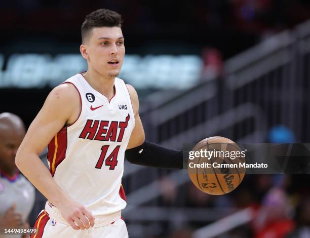 Tyler Herro of the Miami Heat controls the ball during the second half against the Houston Rockets at Toyota Center on December 15, 2022 in Houston,...