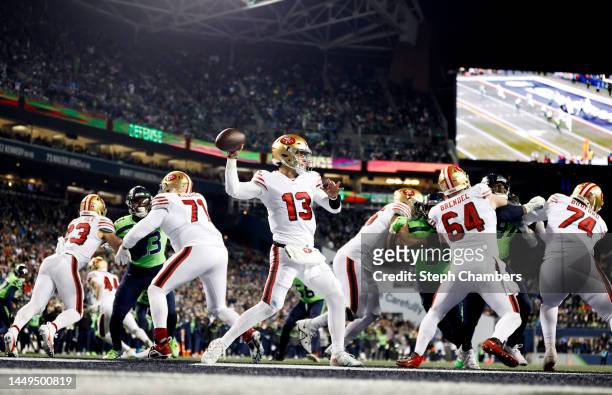 Brock Purdy of the San Francisco 49ers throws a pass against the Seattle Seahawks during the fourth quarter of the game at Lumen Field on December...