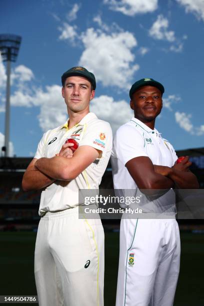 Pat Cummins of Australia and Kagiso Rabada of South Africa pose at The Gabba on December 16, 2022 in Brisbane, Australia.