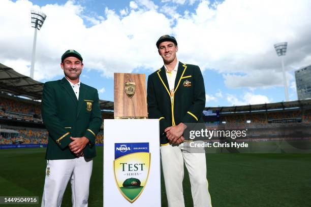 Captains Pat Cummins of Australia and Dean Elgar of South Africa pose at The Gabba on December 16, 2022 in Brisbane, Australia.