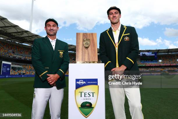 Captains Pat Cummins of Australia and Dean Elgar of South Africa pose at The Gabba on December 16, 2022 in Brisbane, Australia.