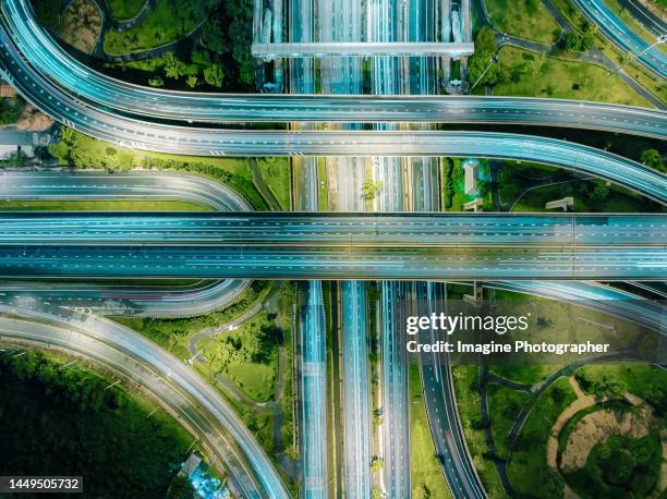 aerial top view, highway road, bridge over main road at night for transportation that facilitates the travel of car users on the road transportation or futuristic concept. - urban road sign stock pictures, royalty-free photos & images