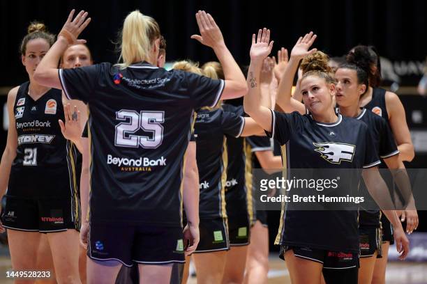 Flames players warm up during the round six WNBL match between Sydney Flames and Melbourne Boomers at Quay Centre, on December 16 in Sydney,...
