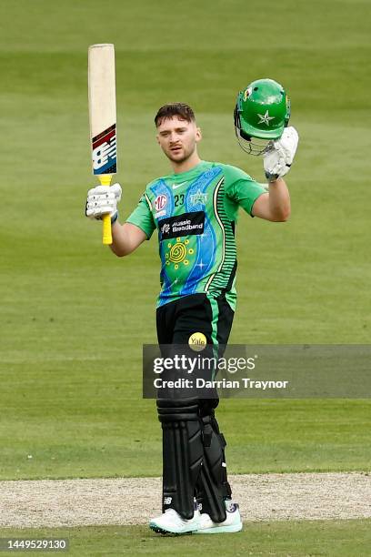 Joe Clarke of the Stars raises his bat after scoring 100 runs during the Men's Big Bash League match between the Melbourne Stars and the Hobart...