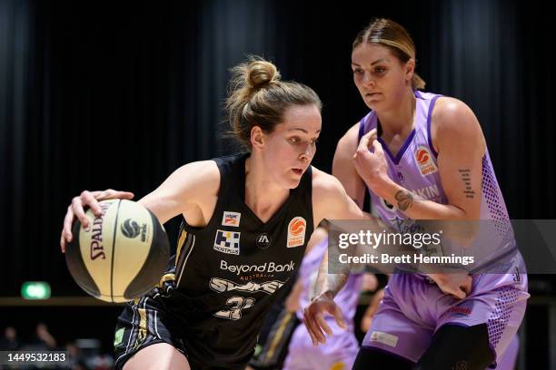 Keely Froling of the Flames drives towards the basket during the round six WNBL match between Sydney Flames and Melbourne Boomers at Quay Centre, on...