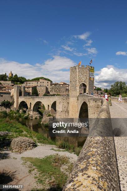 Spain, Catalonia, Girona, Besalu: overview of the fortified bridge built in the 12th century over the Fluvia river. It was used as a tollgate to...