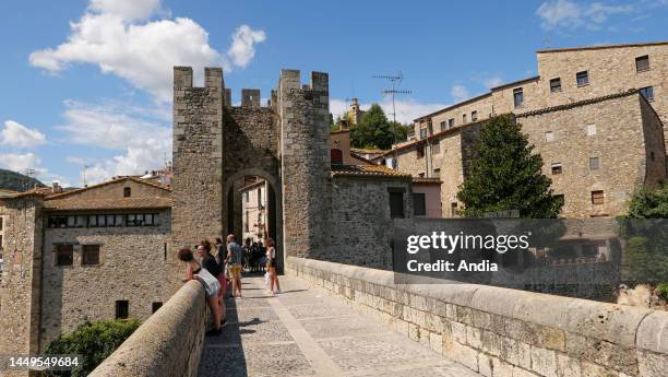 Spain, Catalonia, Girona, Besalu: overview of the fortified bridge built in the 12th century over the Fluvia river. It was used as a tollgate to...