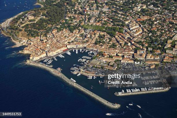 Saint-Tropez, in the Var department : aerial view of the posh seaside resort on the eponymous peninsula and its marina.