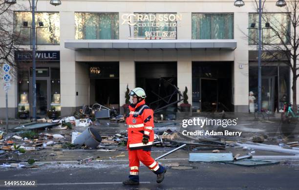 Emergency workers respond at the scene of a broken giant aquarium, on December 16, 2022 in Berlin, Germany. The aquarium, located in the Radisson...