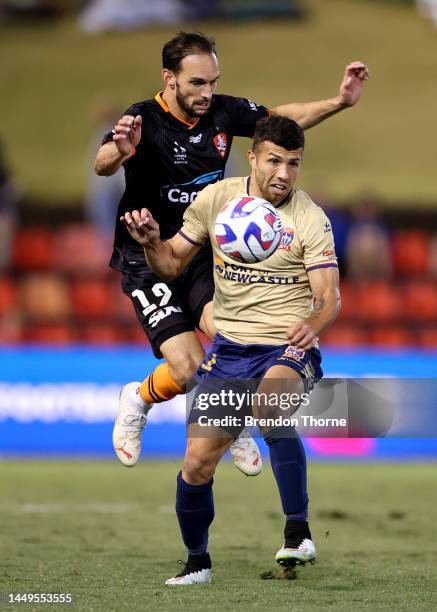 Jaushua Sotirio of the Jets competes with Jack Hingert of the Roar during the round eight A-League Men's match between Newcastle Jets and Brisbane...