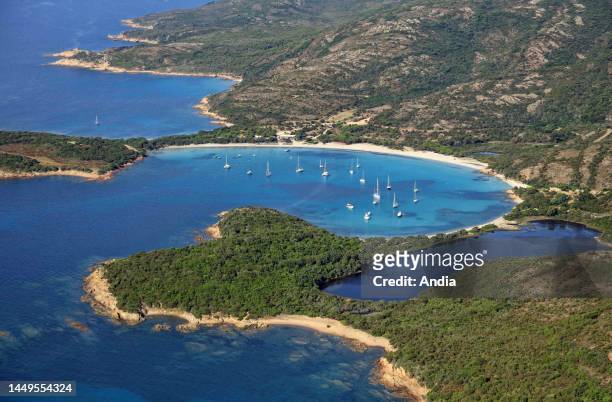 South-east of the island, between Porto-Vecchio and Bonifacio, aerial view of the anchorage off the round beach of Rondinara Sailboats lying at...
