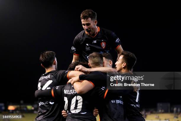 Nikola Mileusnic of the Roar celebrates scoring a goal with team mates during the round eight A-League Men's match between Newcastle Jets and...